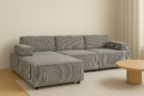 Högupplöst mockup av en LINDÖ modulsoffa i grå manchester i ett ljust, nordiskt vardagsrum.